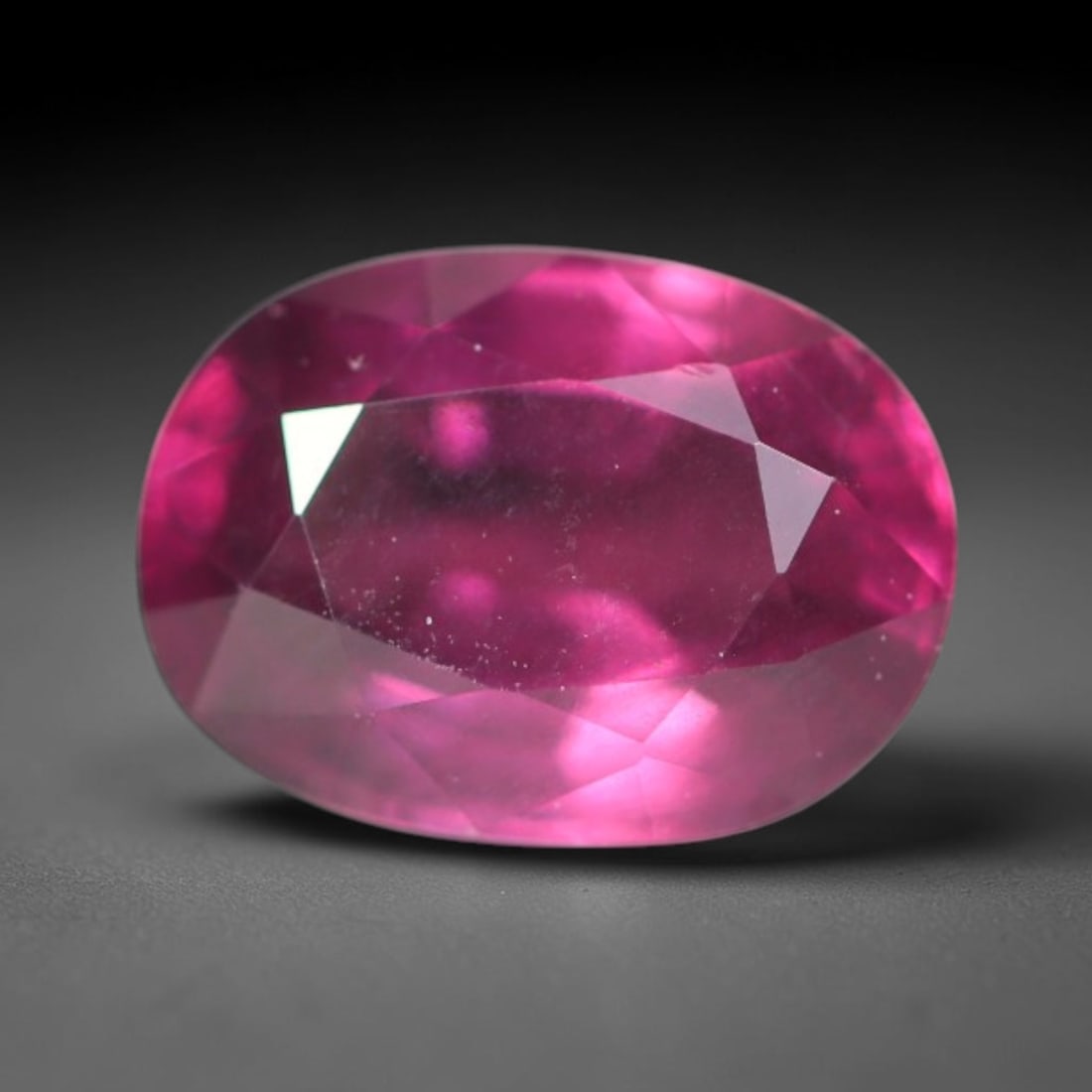 1.37ct Natural Tanzanian Rhodolite Grape Garnet Faceted Loose Gemstone, 87BA: This expertly faceted grape garnet, a scarce saturated purple-magenta rhodolite variant, features transparent crystal structure dotted with faint microscopic mineral specks within its precisely cut re