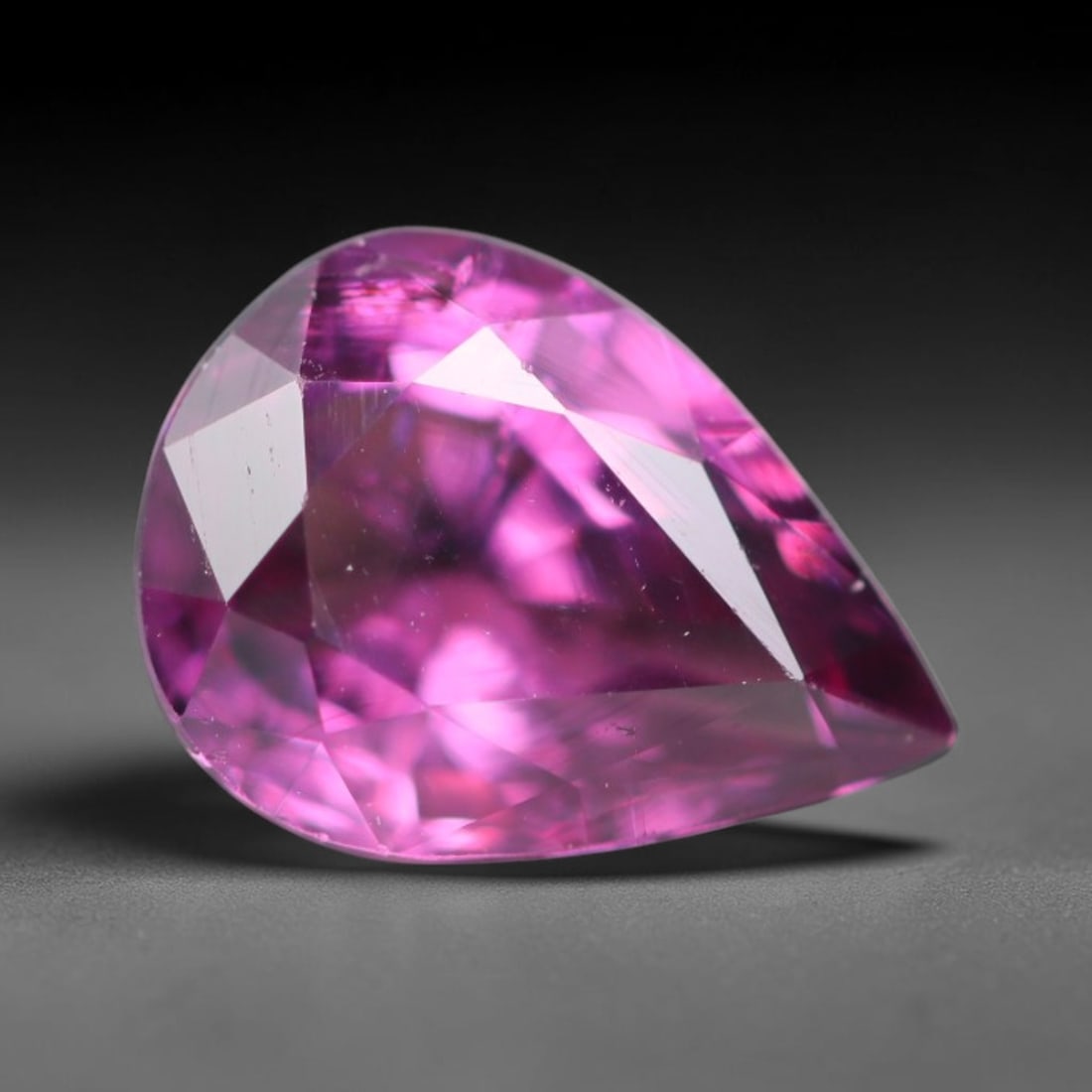 1.68ct Natural Tanzanian Rhodolite Grape Garnet Faceted Loose Gemstone, 76BA: This expertly faceted grape garnet, a scarce saturated purple-magenta rhodolite variant, features transparent crystal structure dotted with faint microscopic mineral specks within its precisely cut re