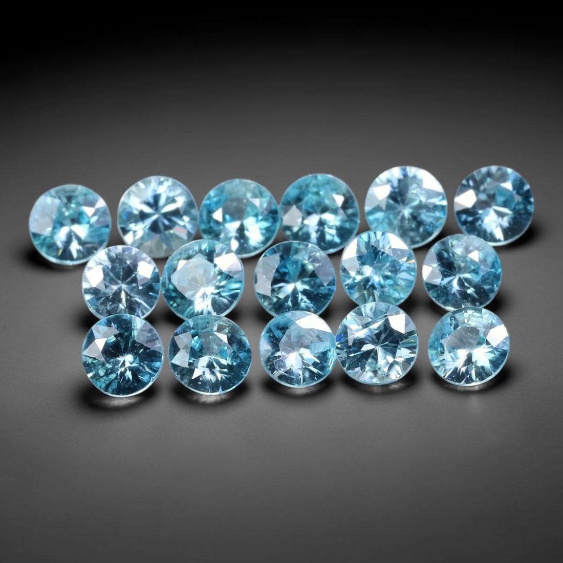 5.49ct Parcel of 16pcs Natural Brazilian Calibrated Round Sky Blue Topaz Loose Gemstones, 31BE: This matched parcel contains sixteen polished calibrated round topaz displaying clean bright sky-blue hue, with faint minor natural internal crystal features within each gemstone, uniform calibrated s