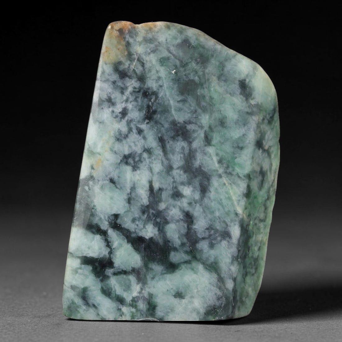 238ct Natural Type A Burmese Jadeite Jade Sliced Rough, 27FB: This specimen is a sliced rough block of natural Type A Burmese jadeite jade. The interior displays natural colour zoning with visible mineral veining and crystalline patterns typical of unprocessed j
