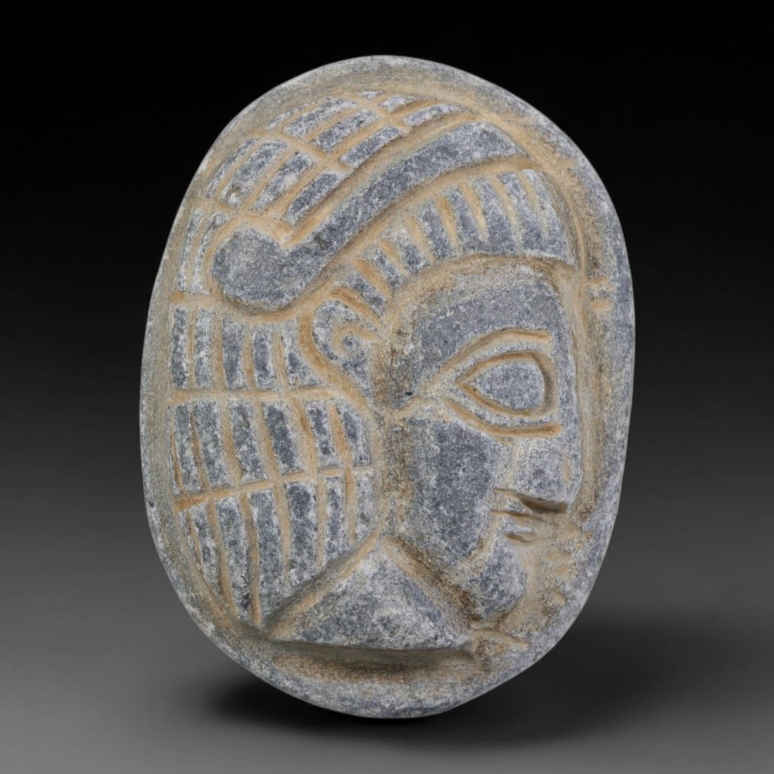 Antique Egyptian Schist Intaglio with Profile Head Carving, 34AA: Hand-carved antique Egyptian amulet tablet crafted from dark grey schist stone, measuring 4.5cm x 3.3cm. The front face features a finely detailed profile human head with incised stylized hair rendere