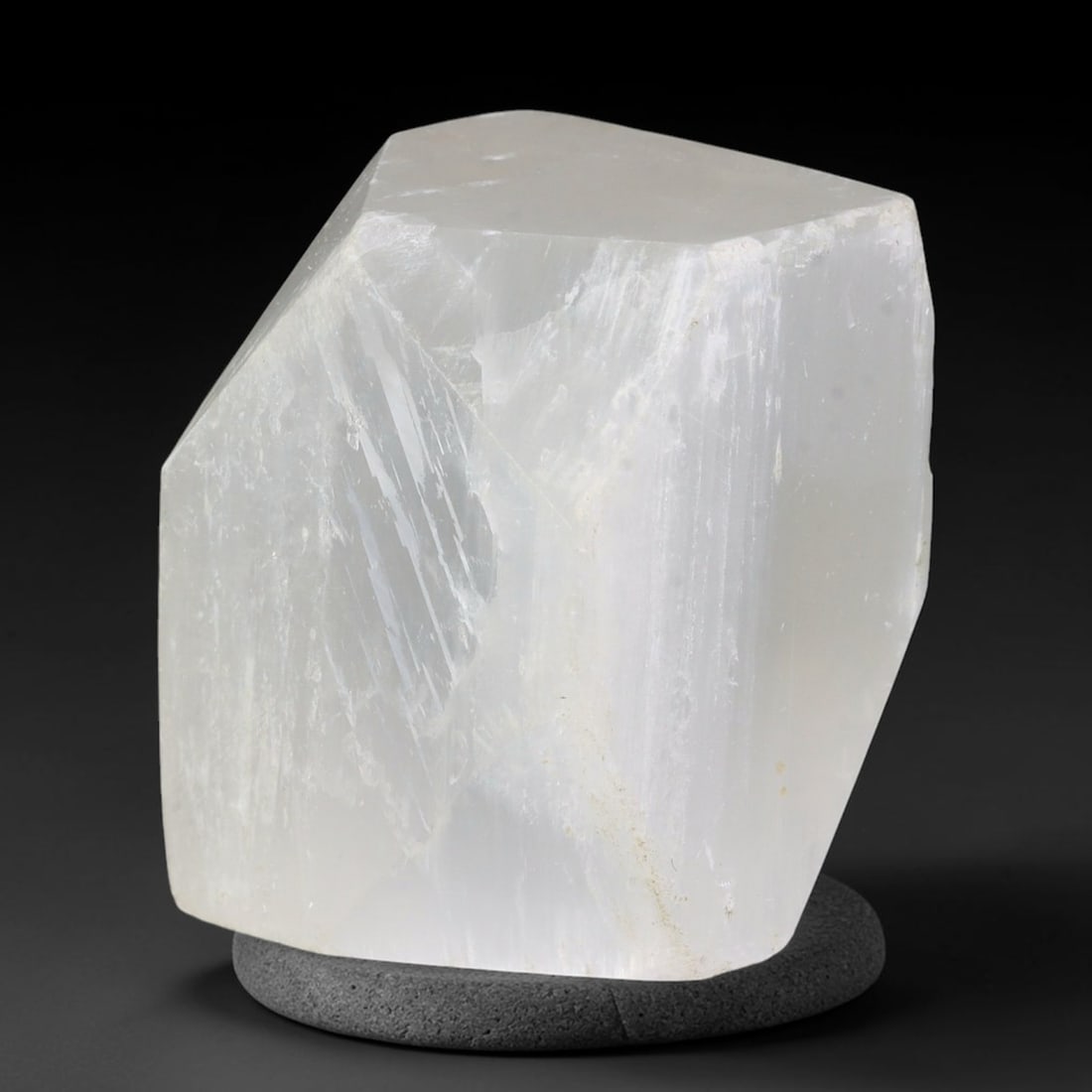 131ct Natural Moroccan Transparent White Selenite Rough Block, 88AH: This solid selenite rough block features milky translucent white body marked by distinct parallel internal striations that catch soft diffused light across its naturally faceted raw planes, faint pale