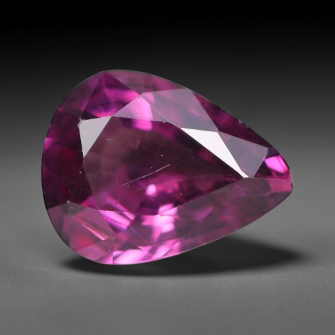 1.20ct Natural Tanzanian Rhodolite Grape Garnet Faceted Loose Gemstone, 86BA: This expertly faceted grape garnet, a scarce saturated purple-magenta rhodolite variant, features transparent crystal structure dotted with faint microscopic mineral specks within its precisely cut re