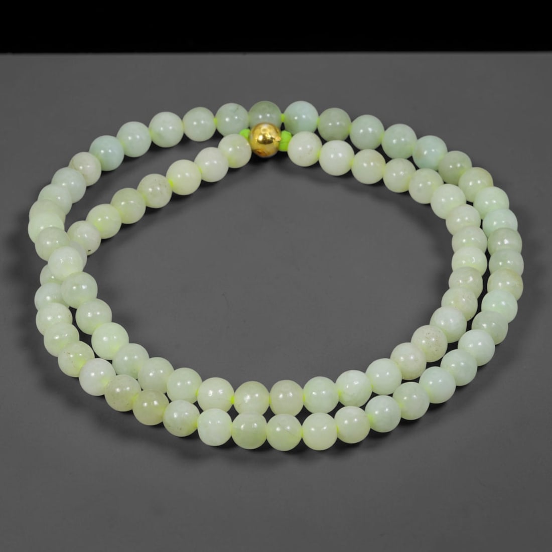 Natural Burmese Type A Jadeite Jade Round Bead Necklace with Gold Gilt Accent Bead, 10BL: Elegant hand-strung necklace made from polished natural untreated Burmese Type A jadeite jade spherical beads, each bead measuring 8 mm in diameter. The jadeite features a soft pale milky celadon hue 