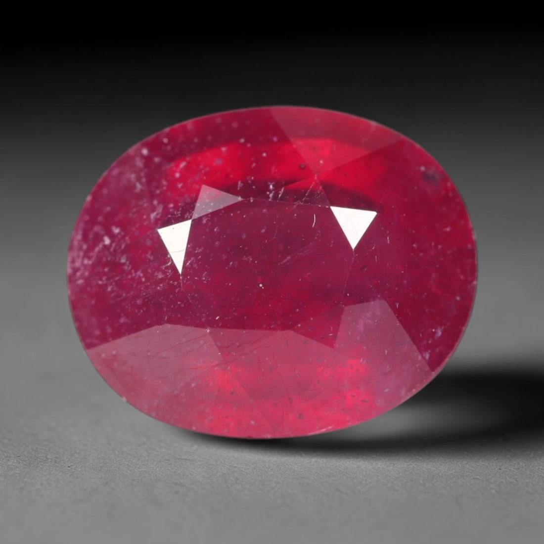 4.81ct Natural Madagascar Vivid Magenta Red Ruby Loose Gemstone, 45BA: This vivid magenta-hued Madagascar ruby boasts rich saturated red-pink saturation scattered with tiny fine mineral specks and distinct two-phase fluid bubble inclusions throughout its translucent crys
