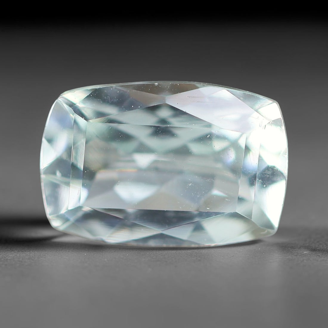 1.16ct Natural Brazilian Sky Blue Faceted Aquamarine Loose Gemstone, 7BF: This precisely faceted aquamarine boasts clear translucent pale sky blue body tone with subtle thin mineral needle and tiny scattered crystalline specks visible within its polished reflective planes i