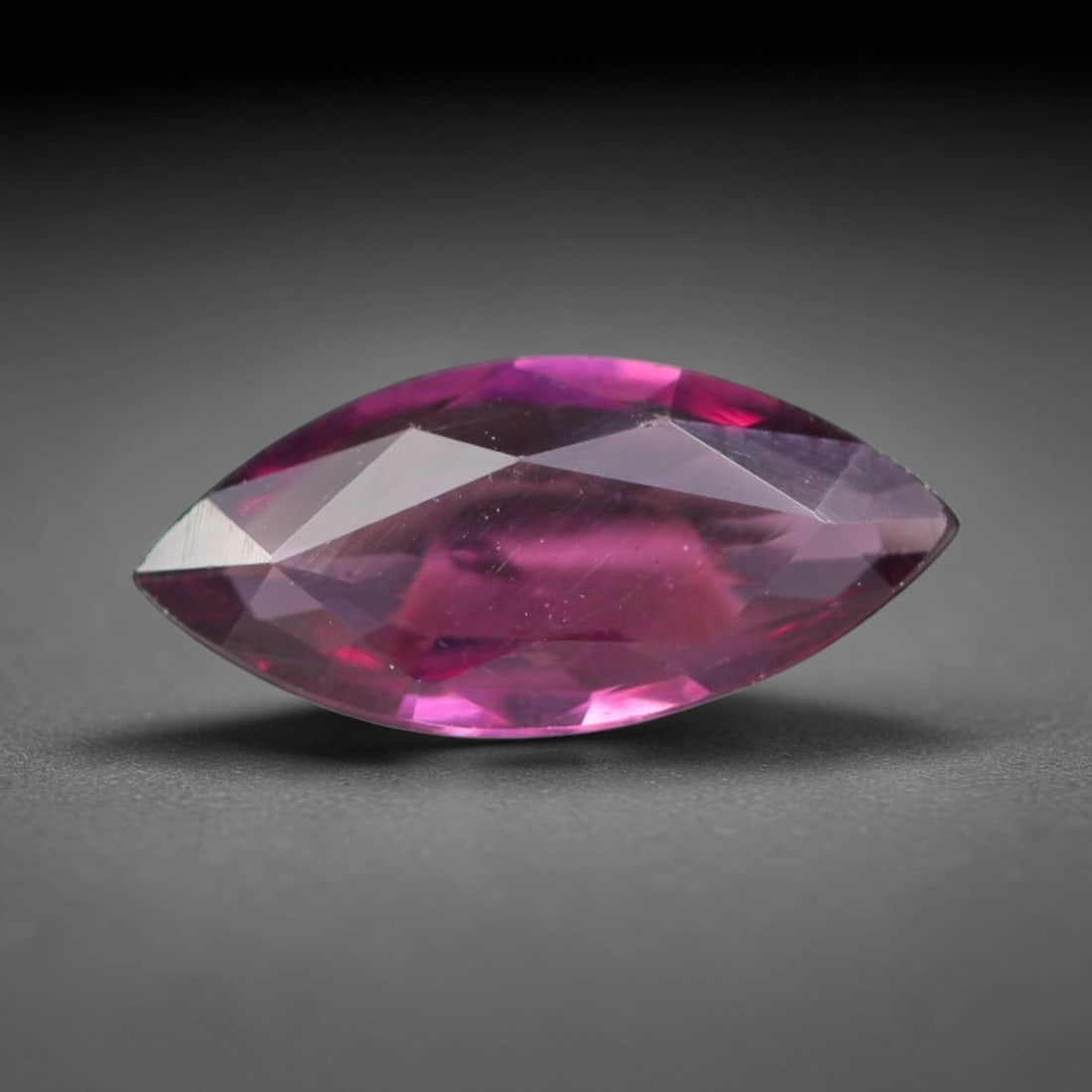 1.43ct Natural Tanzanian Rhodolite Grape Garnet Faceted Loose Gemstone, 85BA: This expertly faceted grape garnet, a scarce saturated purple-magenta rhodolite variant, features transparent crystal structure dotted with faint microscopic mineral specks within its precisely cut re