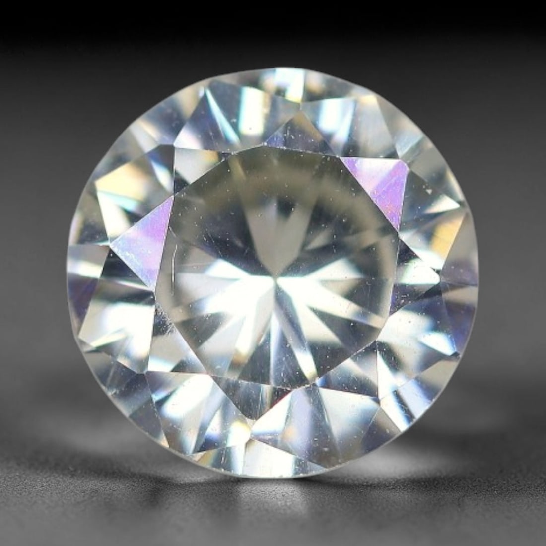1.62 Carats Natural Cool White Moissanite Loose Gemstone, 30FP: This cool white moissanite holds dimension measurements of 8x4.3mm, delivering exceptional light dispersion that generates vivid rainbow sparkle across its fully transparent body, with faint microscop