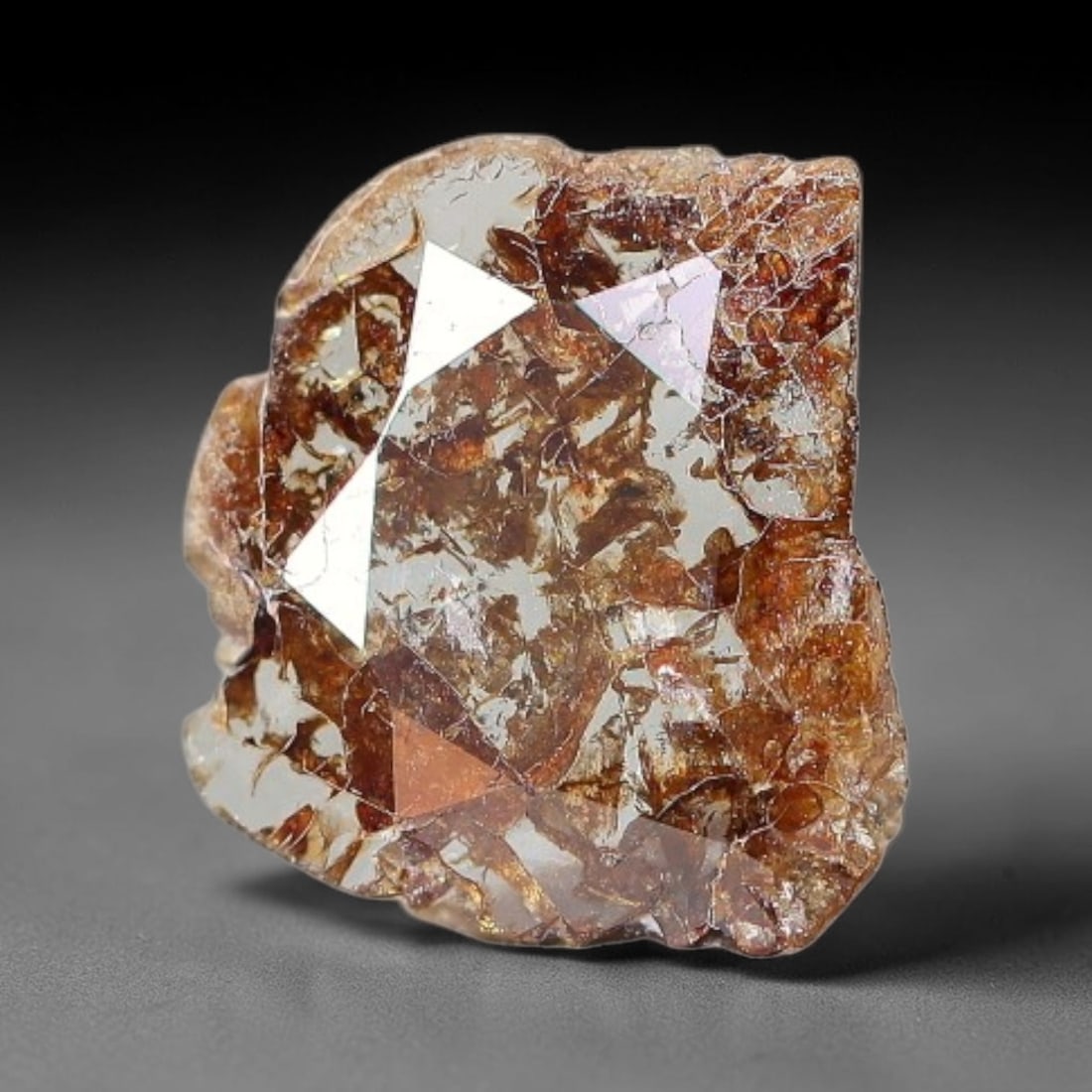 0.30ct Natural Fancy Diamond Slice, 64BG: This unique natural diamond slice features a delicate hand-executed rose cut surface, showcasing captivating pictorial mineral inclusions trapped within the diamond matrix. Measuring 6.5x5.9x0.6mm, th