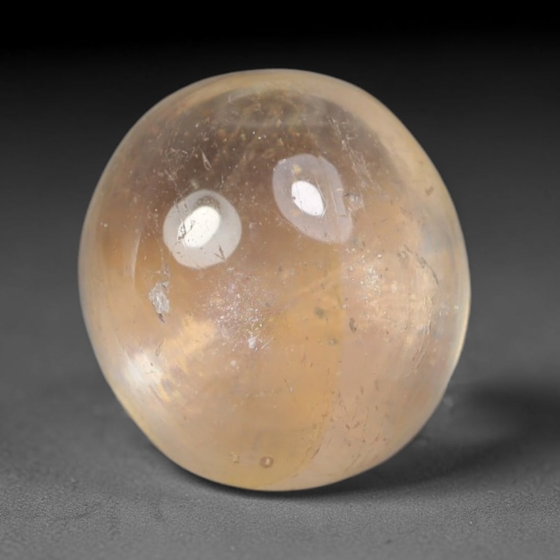 2.51ct Natural Sri Lankan Padparadscha Sapphire Loose Gemstone, 70BA: This fully polished Padparadscha sapphire features soft warm peach-orange blended body tone, with faint natural mineral traces scattered throughout its crystalline interior, measured at calibrated dim
