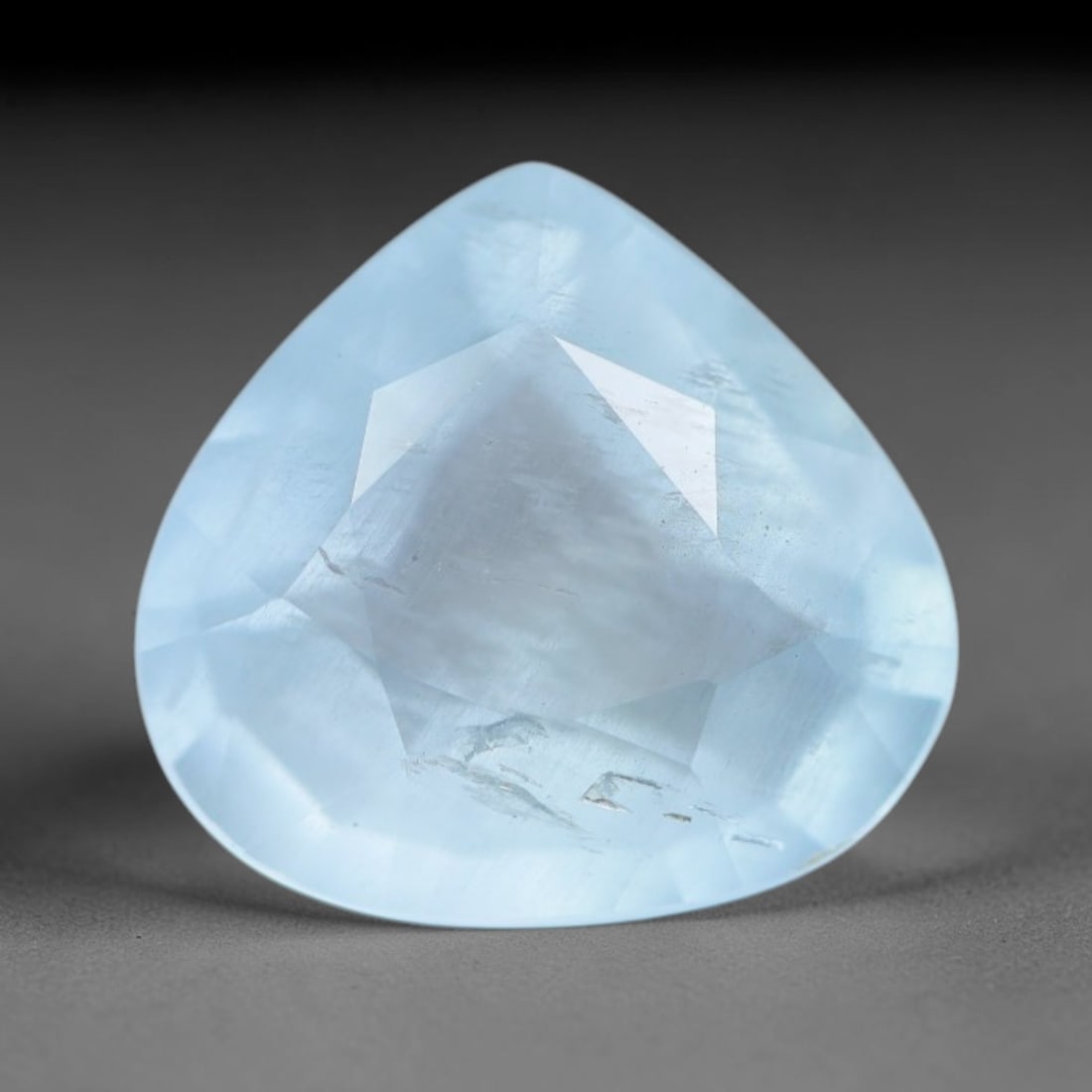 2.70ct Natural Brazilian Soft Sky Blue Faceted Aquamarine Loose Gemstone, 5AS: This expertly faceted aquamarine carries a gentle soft sky blue translucent body with faint fine natural internal mineral markings visible through its polished reflective facets within its 12x9.4x5.1m