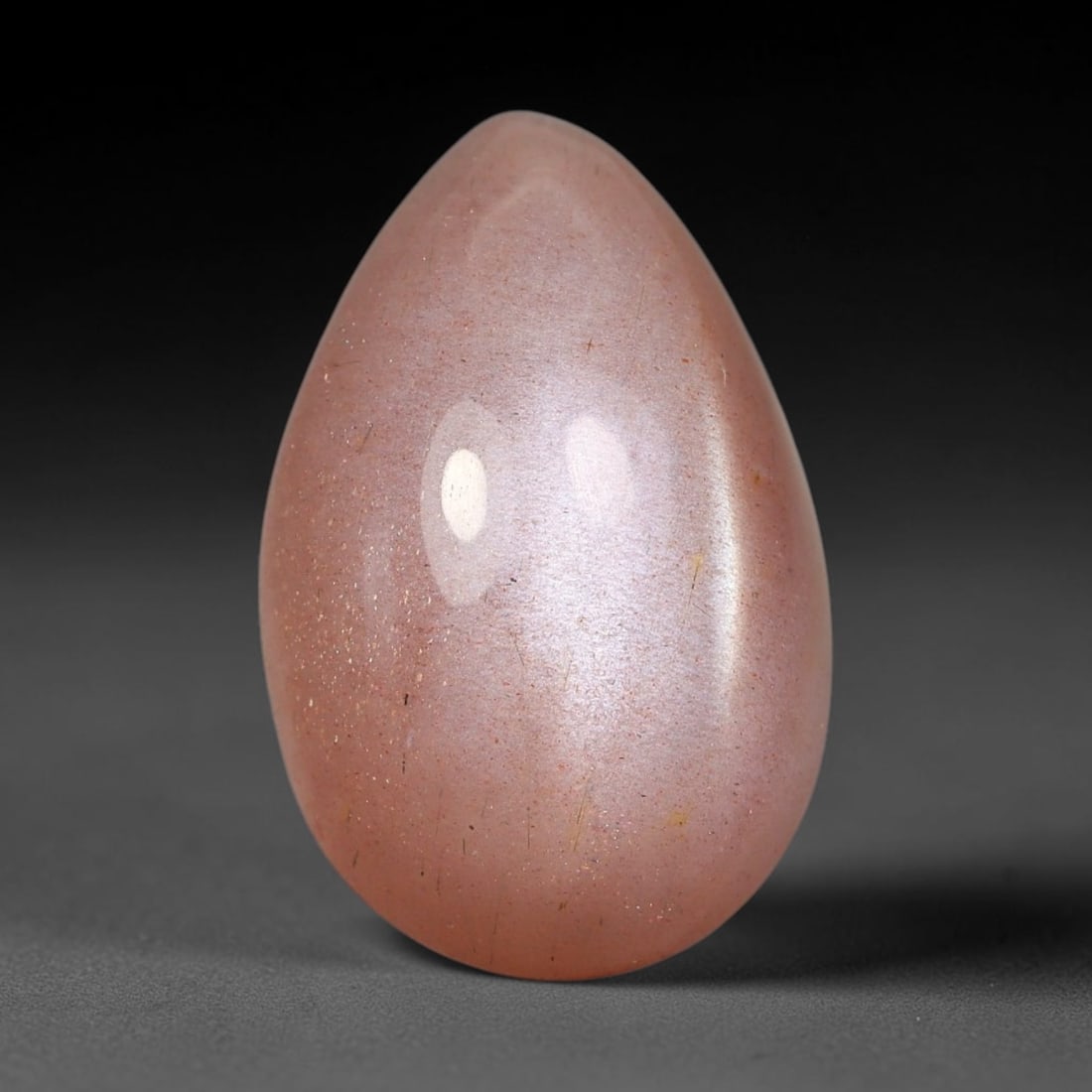 12.20 Carats Natural Ceylon Warm Peach Moonstone Loose Gemstone, 91FE: This natural Ceylon moonstone has dimension measurements of 19.4x12.6x7.6mm, showcasing a smooth warm peach base tone paired with subtle soft adularescent sheen that glides gently across the polished 