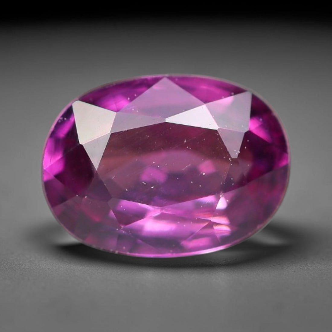 1.08ct Natural Tanzanian Rhodolite Grape Garnet Faceted Loose Gemstone, 92BF: This expertly faceted grape garnet, a scarce saturated purple-magenta rhodolite variant, features transparent crystal structure dotted with faint microscopic mineral specks within its precisely cut re