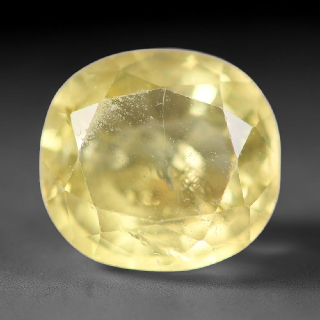 2.37ct Natural Mexican Lemon Yellow Faceted Apatite Loose Gemstone, 88AR: This expertly faceted yellow apatite holds translucent pale lemon yellow crystal structure with faint tiny internal mineral specks and subtle fine linear markings visible beneath its precisely polishe