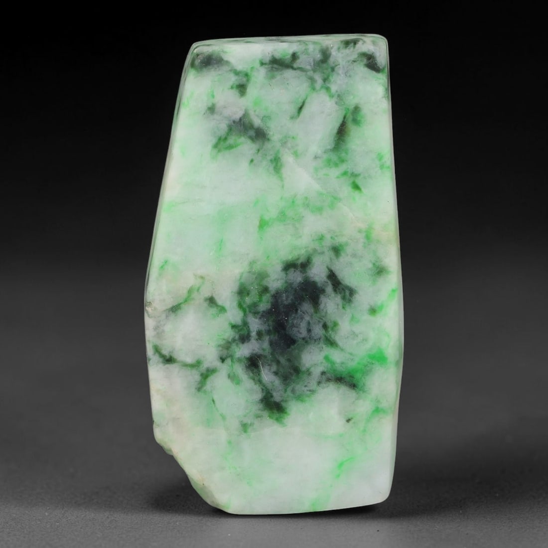 125ct Natural Type A Burmese Jadeite Jade Sliced Rough, 23FB: This specimen is a sliced rough block of natural Type A Burmese jadeite jade. The interior displays natural colour zoning with visible mineral veining and crystalline patterns typical of unprocessed j