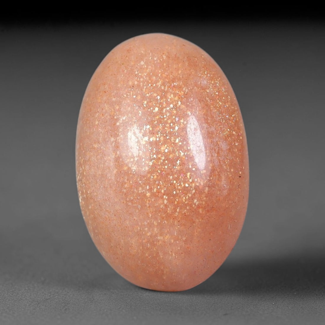 11.98 Carats Natural Ceylon Warm Peach Moonstone Loose Gemstone, 85FE: This natural Ceylon moonstone has dimension measurements of 19.1x12.7x7mm, showcasing a smooth warm peach base tone paired with subtle soft adularescent sheen that glides gently across the polished su