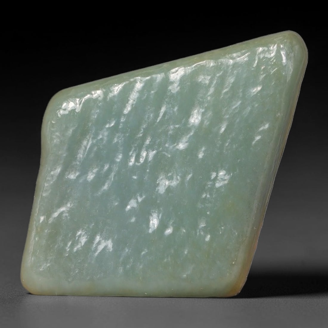 69ct Natural Type A Burmese Jadeite Jade Polished Sliced Rough, 79AZ: This specimen is a sliced rough block of natural Type A Burmese jadeite jade. The interior displays natural colour zoning with visible mineral veining and crystalline patterns typical of unprocessed j