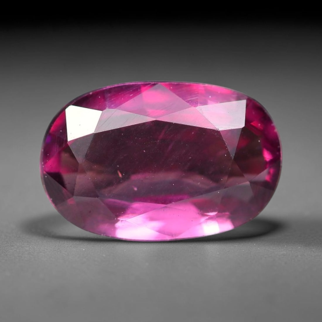 1.26ct Natural Tanzanian Rhodolite Grape Garnet Faceted Loose Gemstone, 86BF: This expertly faceted grape garnet, a scarce saturated purple-magenta rhodolite variant, features transparent crystal structure dotted with faint microscopic mineral specks within its precisely cut re