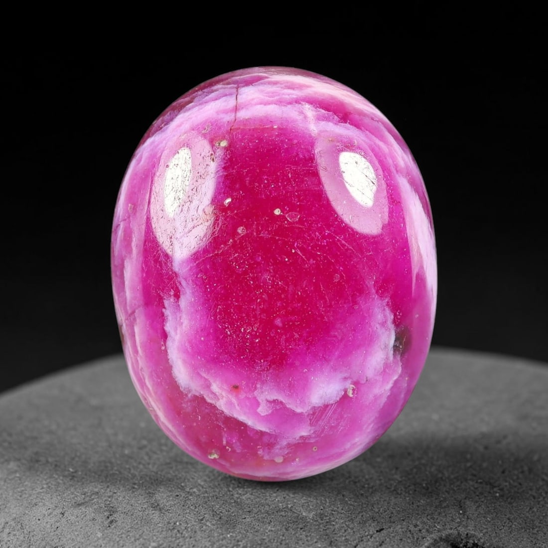 24.07 Carats Natural Mozambique Vivid Pink Red Ruby Loose Gemstone, 55FG: This polished Mozambique ruby cabochon measures 21.5x16.8x6.3mm, featuring striking natural swirling white mineral banding layered across a rich saturated pink red base that creates a unique organic a