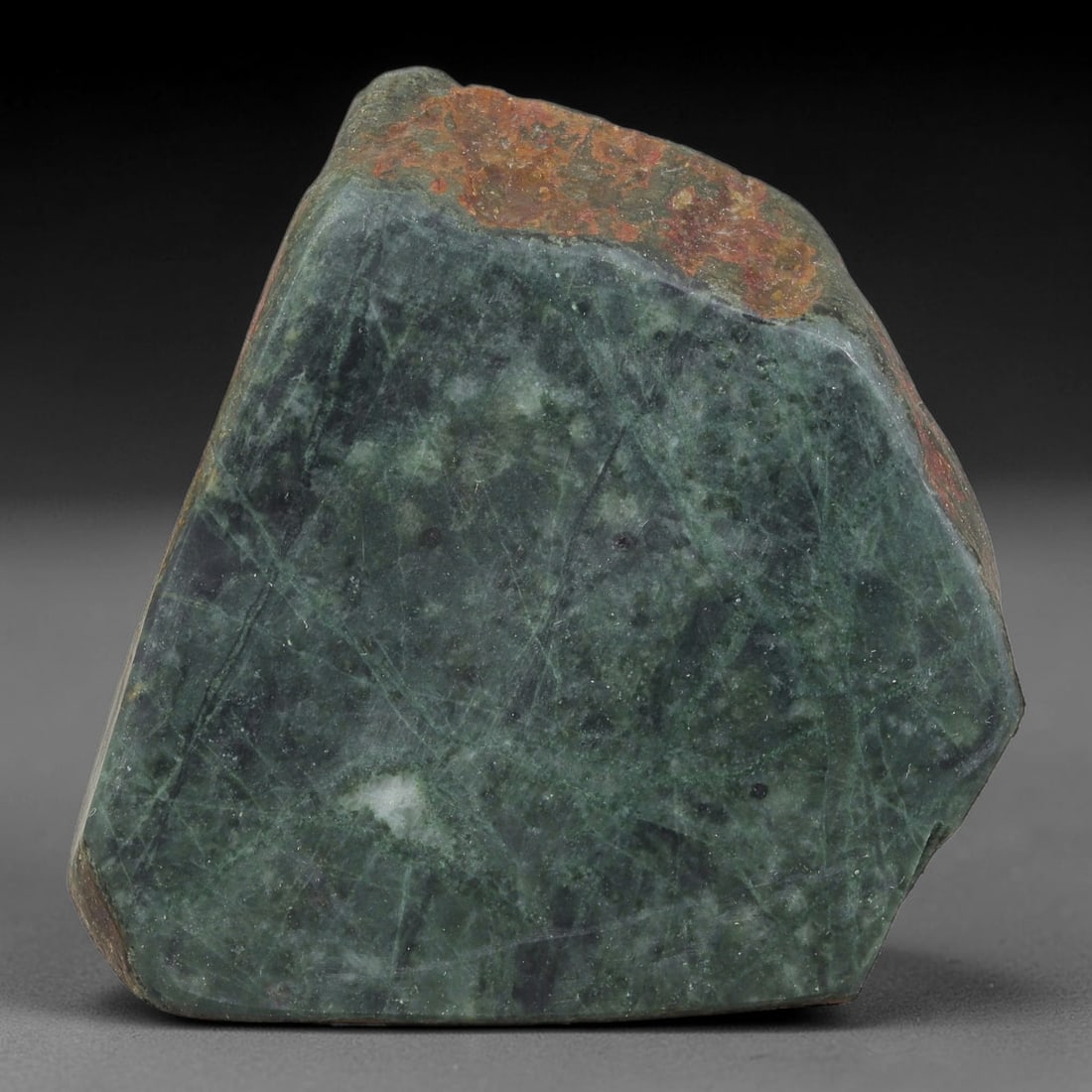 470ct Natural Type A Burmese Jadeite Jade Sliced Rough, 61FB: This specimen is a sliced rough block of natural Type A Burmese jadeite jade. The interior displays natural colour zoning with visible mineral veining and crystalline patterns typical of unprocessed j
