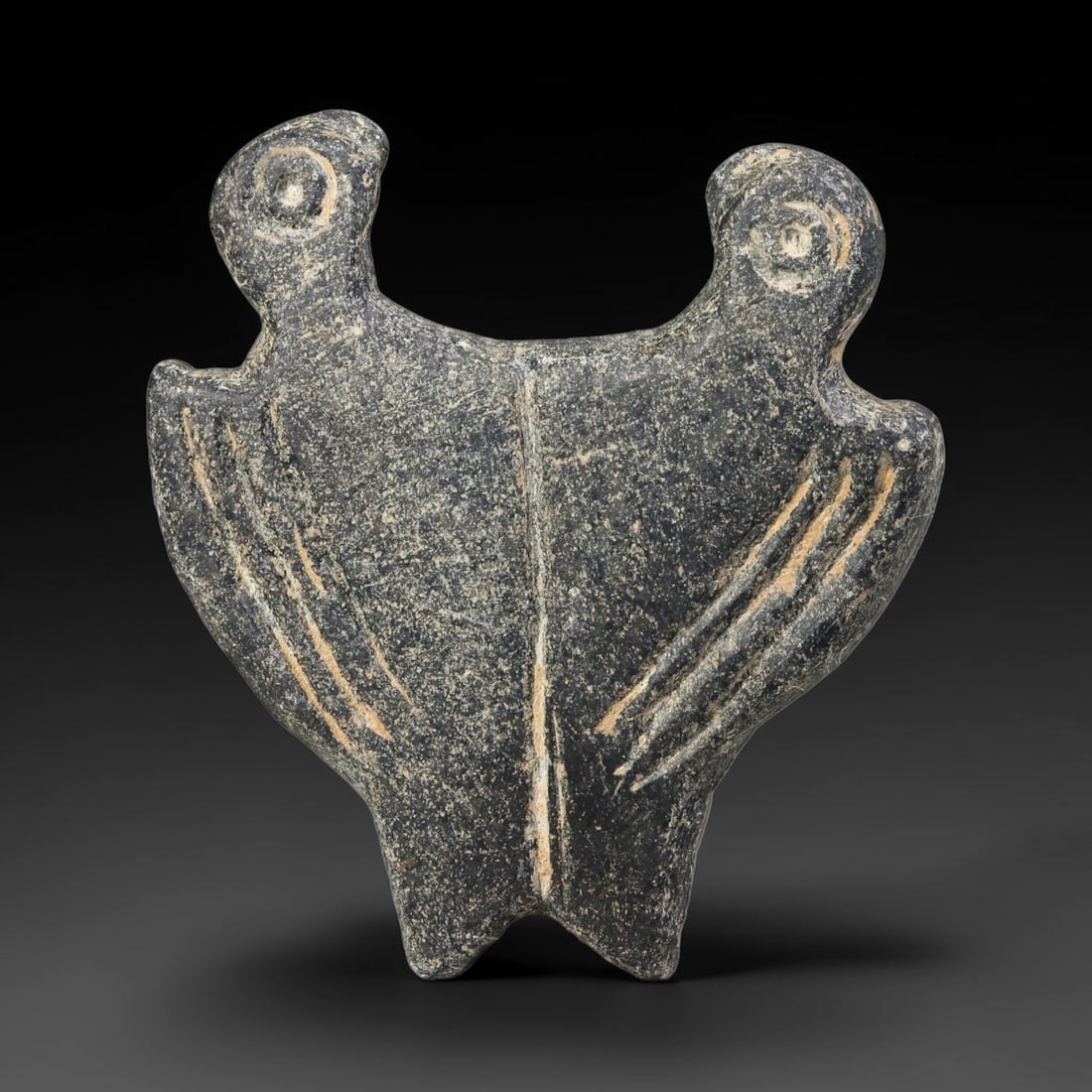 Ancient Sasanian Persian Twin Bird Zoomorphic Amulet Plaque (224-651 CE), 40EF: This ancient zoomorphic amulet plaque is carved from dark schist, originating from the Sasanian Persian Empire, a prominent late antique Persian culture renowned for stone talisman production linked t