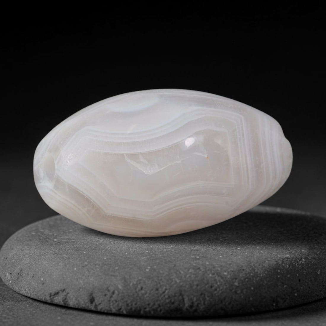 Ancient Old Babylonian Kingdom Geometric Banded Agate Barrel Bead (1894-1595 BCE), 96AD: This antique banded agate barrel bead originates from the Old Babylonian Kingdom, a foundational Mesopotamian civilization famed for precise lapidary craft producing ritual talisman beads for temple o