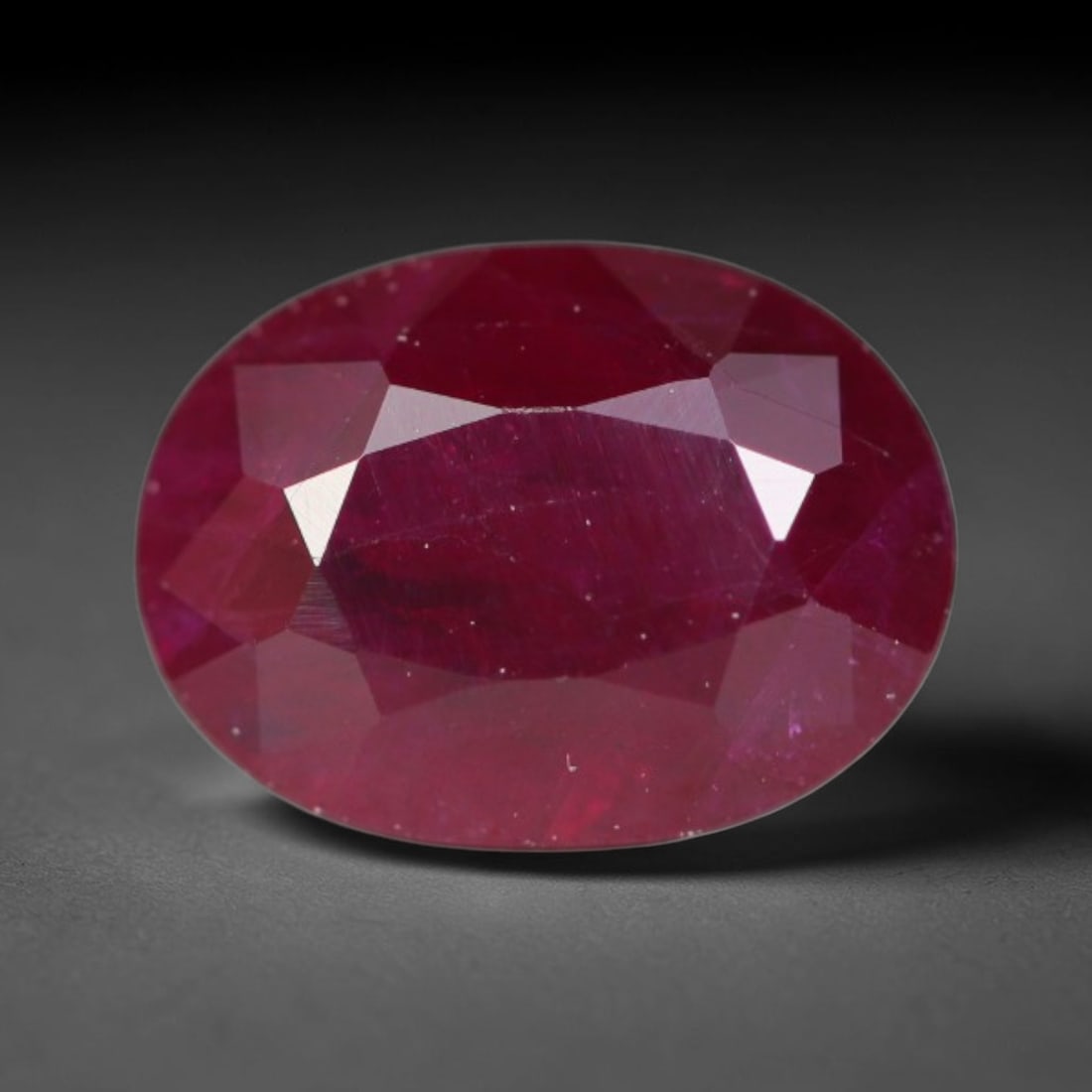 1.01ct Natural Tanzanian Longido Deep Crimson Red Faceted Ruby Loose Gemstone, 25BD: This expertly faceted Longido ruby features a rich deep crimson red body tone with distinct natural linear mineral striations, scattered pale mineral deposits and minor dark mineral flecks visible wit