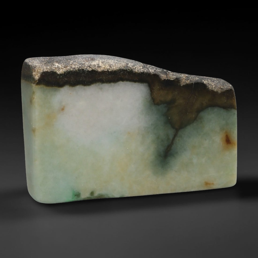 310ct Natural Type A Burmese Jadeite Jade Sliced Rough, 82EF: This specimen is a sliced rough block of natural Type A Burmese jadeite jade. The interior displays natural colour zoning with visible mineral veining and crystalline patterns typical of unprocessed j