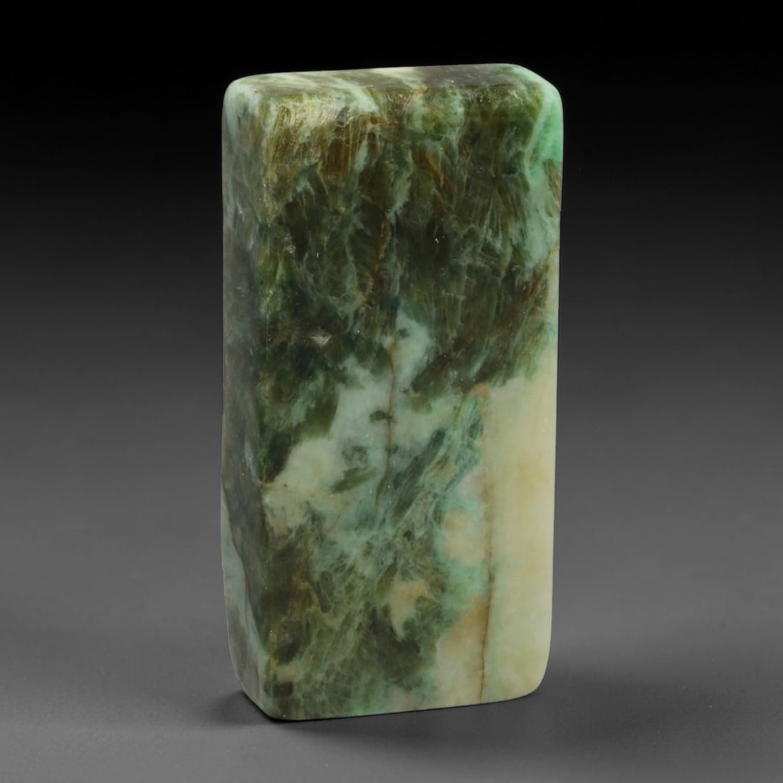 270ct Natural Type A Burmese Jadeite Jade Sliced Rough, 83EF: This specimen is a sliced rough block of natural Type A Burmese jadeite jade. The interior displays natural colour zoning with visible mineral veining and crystalline patterns typical of unprocessed j