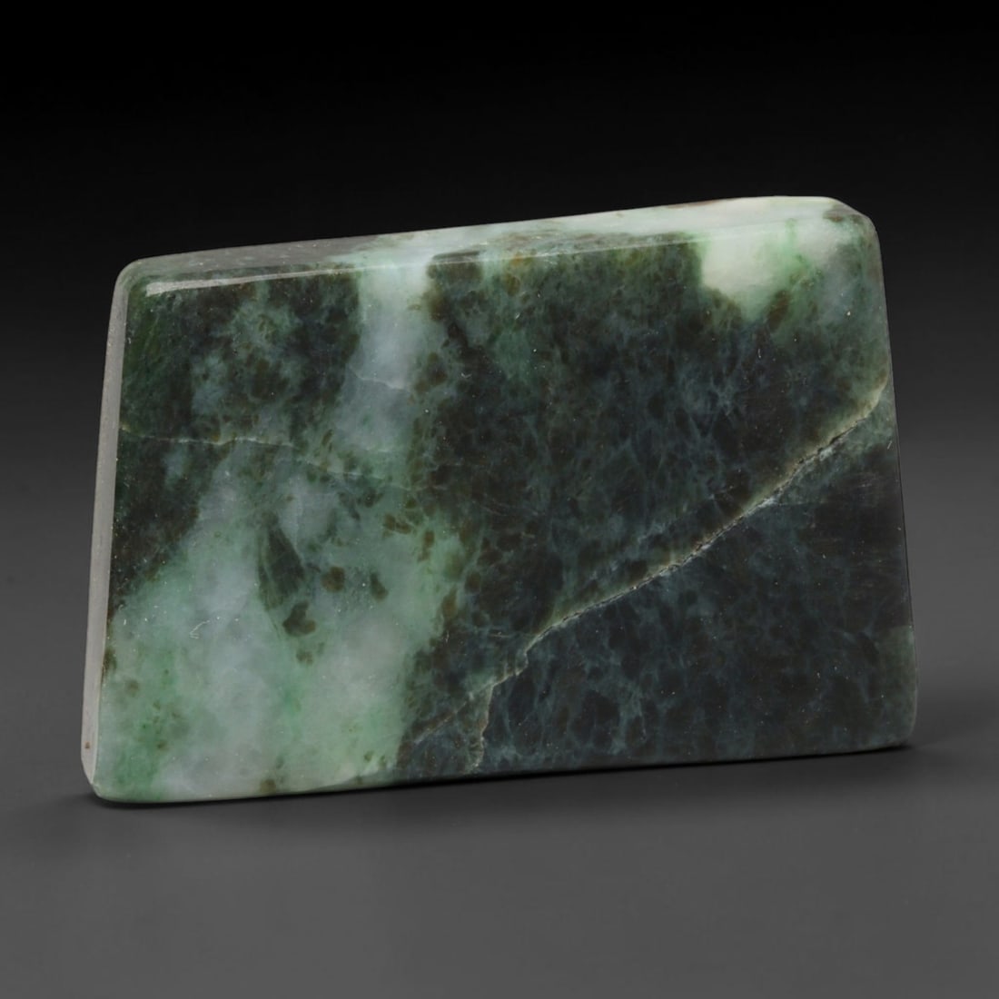 330ct Natural Type A Burmese Jadeite Jade Sliced Rough, 77EF: This specimen is a sliced rough block of natural Type A Burmese jadeite jade. The interior displays natural colour zoning with visible mineral veining and crystalline patterns typical of unprocessed j