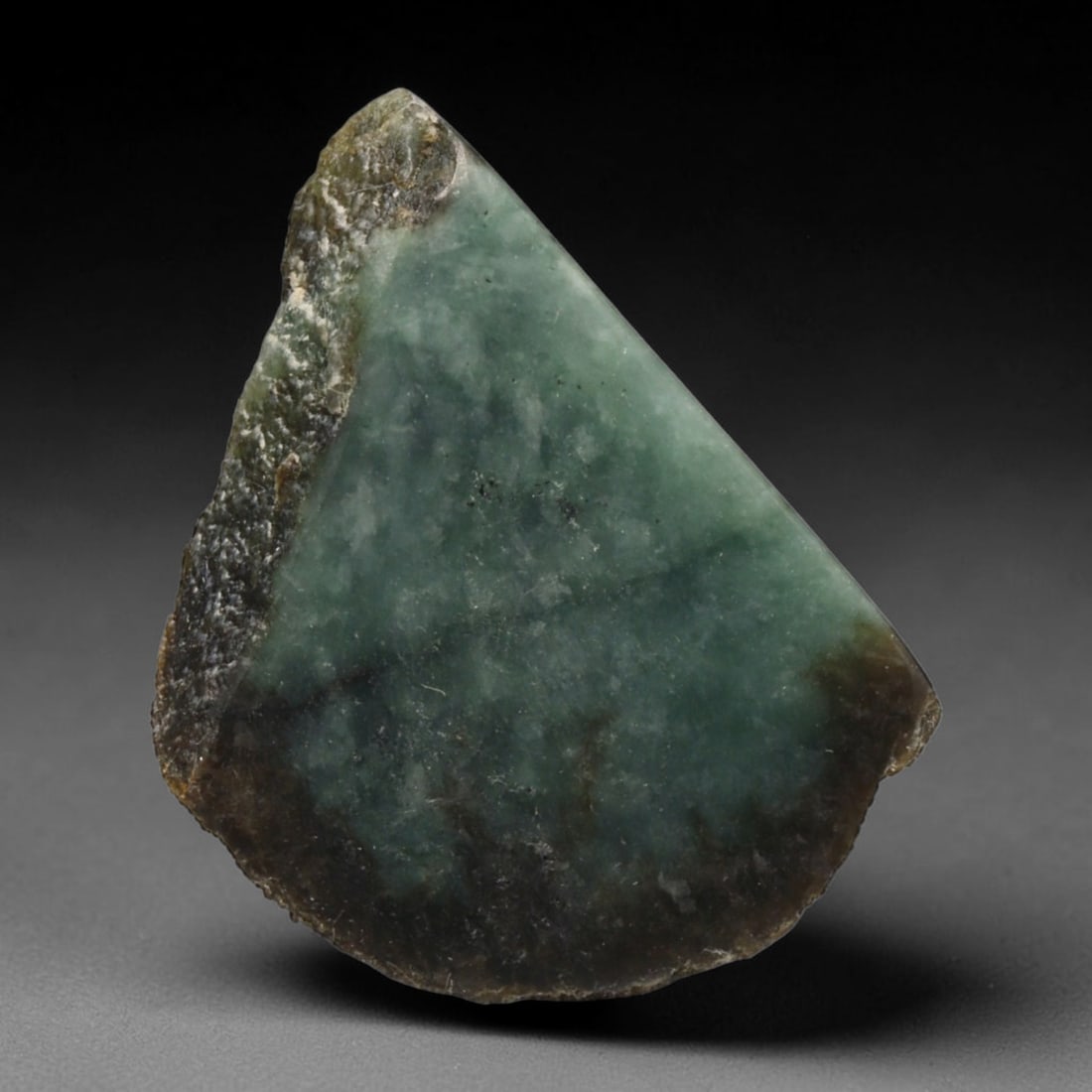 105ct Natural Type A Burmese Jadeite Jade Sliced Rough, 89EF: This specimen is a sliced rough block of natural Type A Burmese jadeite jade. The interior displays natural colour zoning with visible mineral veining and crystalline patterns typical of unprocessed j