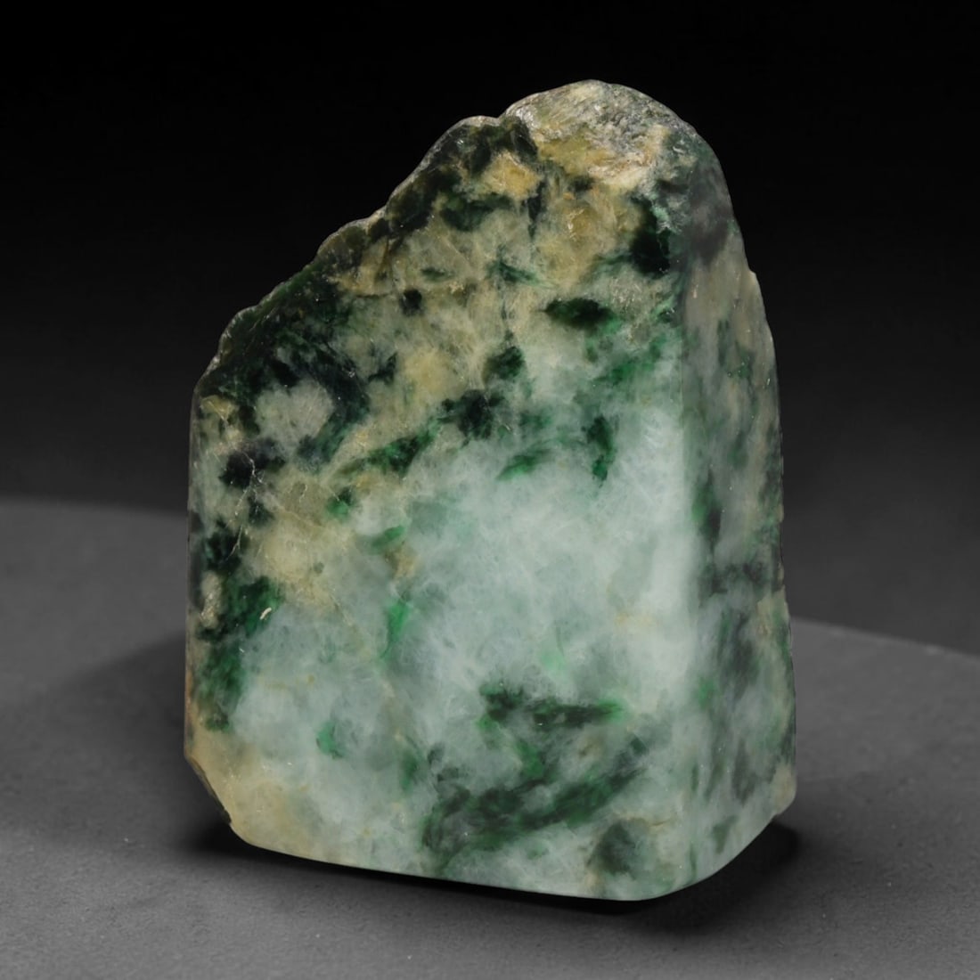 530ct Natural Type A Burmese Jadeite Jade Sliced Rough, 84EF: This specimen is a sliced rough block of natural Type A Burmese jadeite jade. The interior displays natural colour zoning with visible mineral veining and crystalline patterns typical of unprocessed j