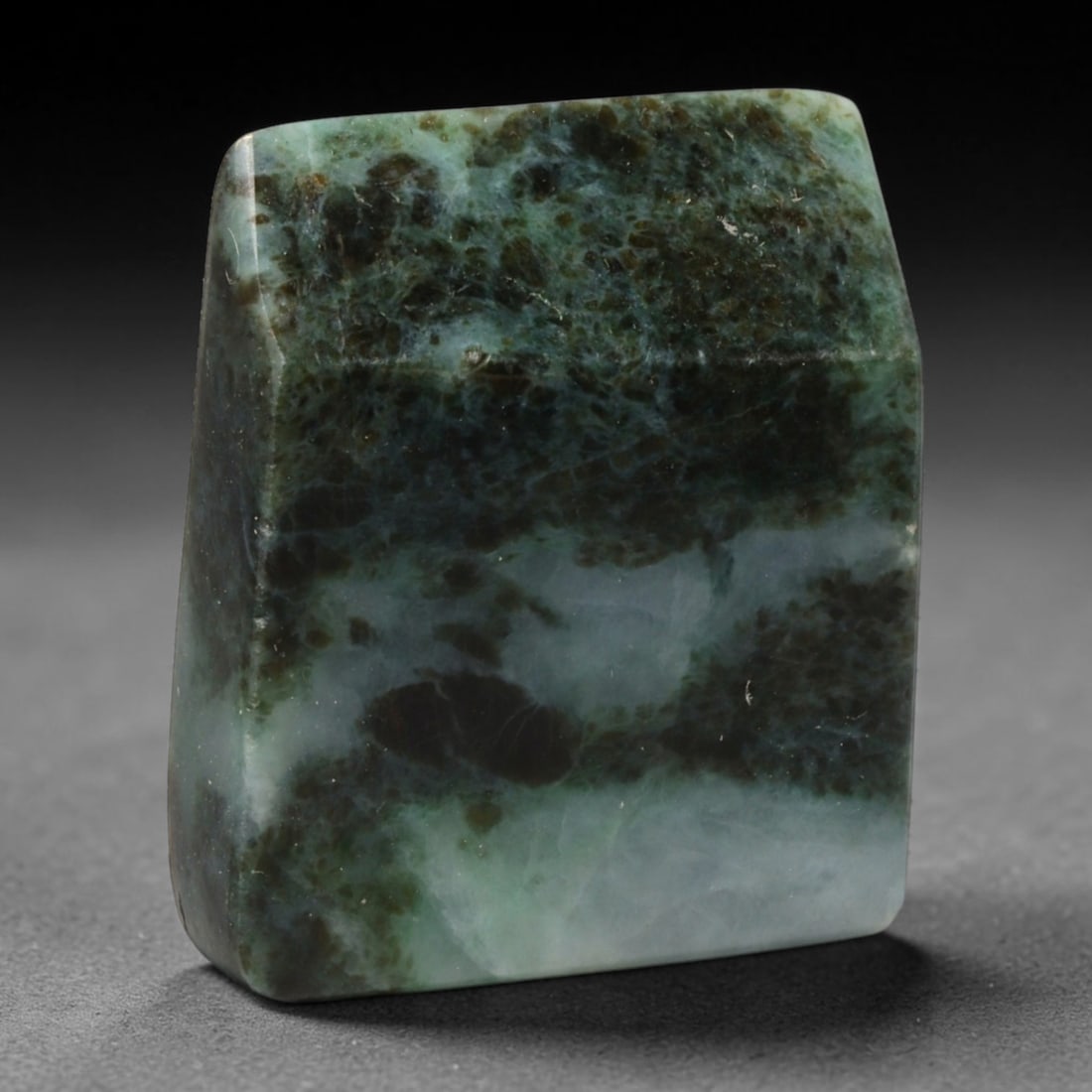 230ct Natural Type A Burmese Jadeite Jade Sliced Rough, 92EF: This specimen is a sliced rough block of natural Type A Burmese jadeite jade. The interior displays natural colour zoning with visible mineral veining and crystalline patterns typical of unprocessed j