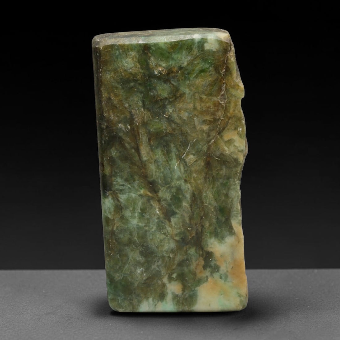 250ct Natural Type A Burmese Jadeite Jade Sliced Rough, 94EF: This specimen is a sliced rough block of natural Type A Burmese jadeite jade. The interior displays natural colour zoning with visible mineral veining and crystalline patterns typical of unprocessed j