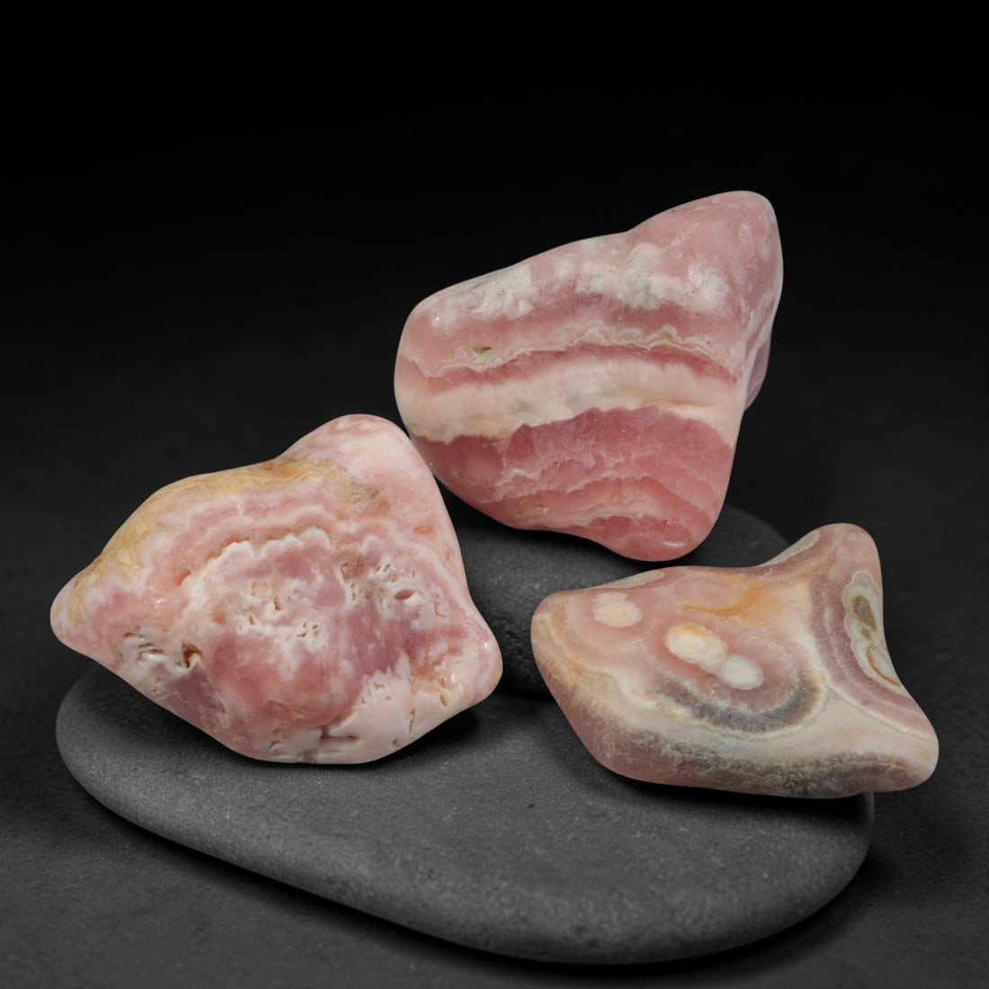 54ct 3pcs Natural Argentine Rhodochrosite Banded Tumbled Rough Set, 12FD: This listing features three individual tumbled rhodochrosite rough pieces sourced from Argentina Capillitas deposits, each showcasing distinct layered banding of soft rose pink, cream white and pale t