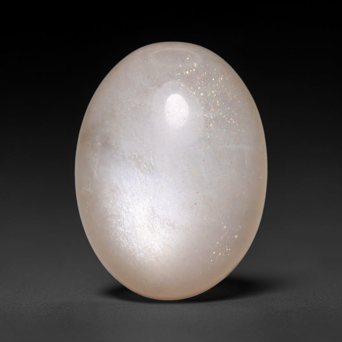 12.97ct Natural Ceylon Grey Moonstone Cabochon Loose Gemstone, 11FY: This natural Ceylon moonstone cabochon carries a soft grey body showcasing classic adularescence. Fine mineral inclusions are visible within the gem. Dimensions measure 17x13x8mm, mined in Sri Lanka, 