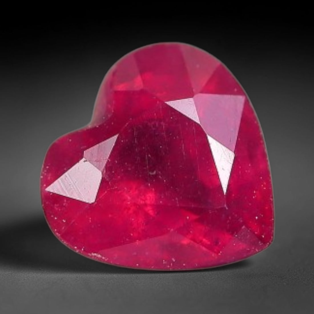 0.95 Carats Natural Madagascar Vivid Fuchsia Red Heated Ruby Loose Gemstone, 62FM: This vivid fuchsia red Madagascar ruby displays rich saturated red tone with subtle natural internal mineral traces that showcase genuine earth-grown character, measured at 6x3.5mm, the intense warm c