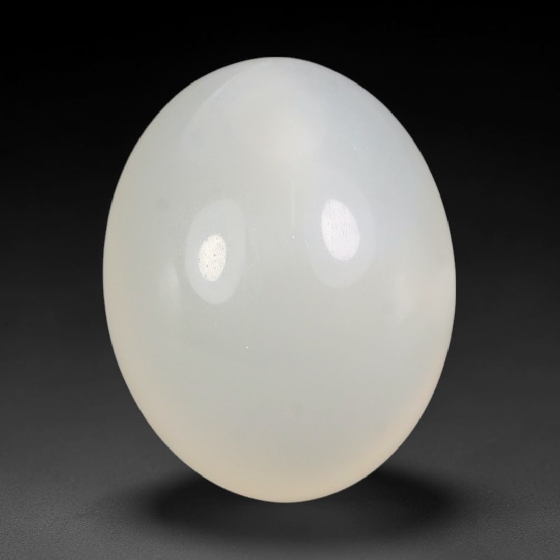 14.83 Carats Natural Ceylon Soft Milky White Moonstone Loose Gemstone, 73FE: This natural Ceylon moonstone carries a smooth milky white base with subtle gentle adularescent glow across its polished surface, measured at 17.8x13.8x8.5mm, showcasing clean even transparency with m