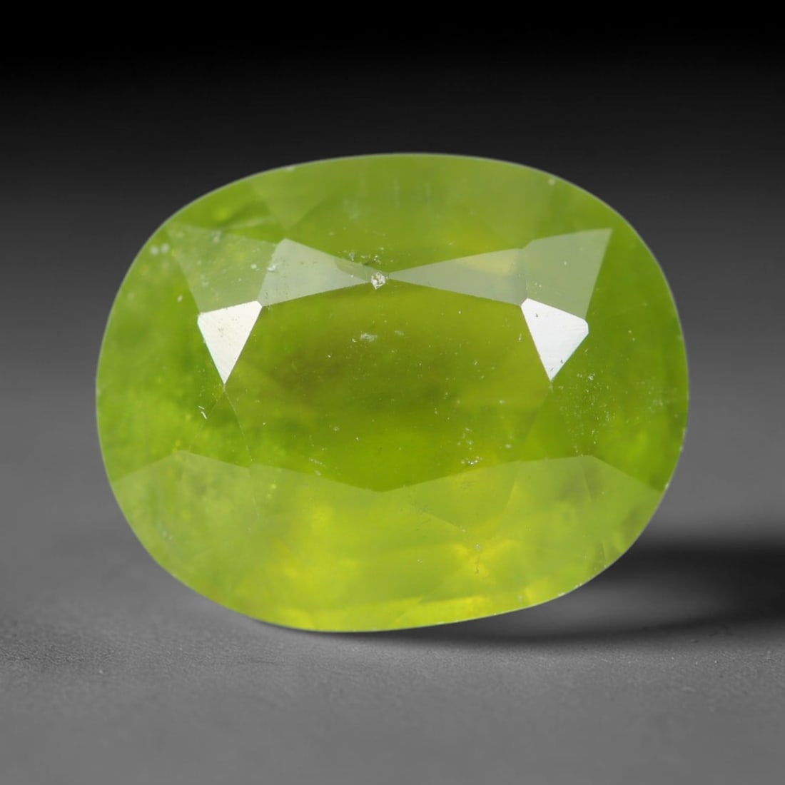 3.39ct Natural Mexican Lime Green Faceted Sphene Loose Gemstone, 52BA: This precisely faceted sphene exhibits vivid translucent lime green body tone, featuring fine natural mineral veils and tiny scattered crystalline micro-inclusions trapped within its high-refractive c