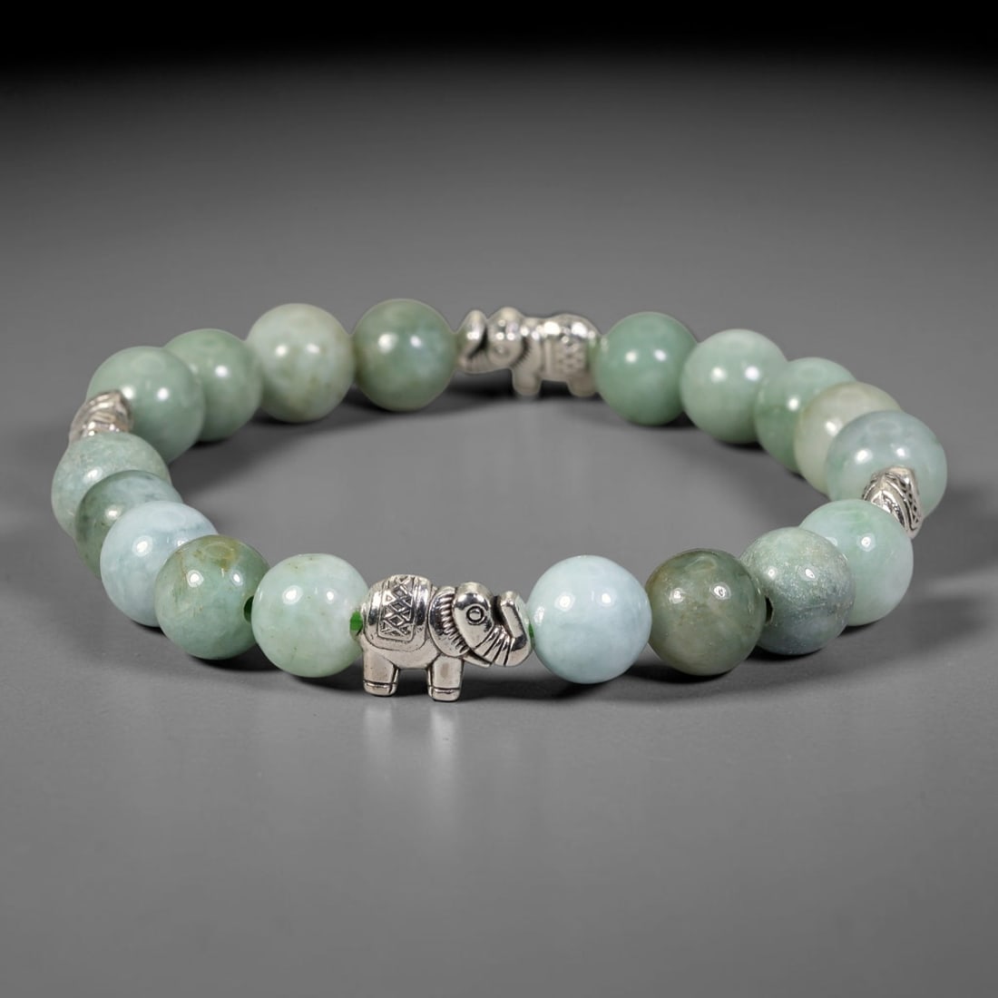 Natural Burmese Type A Jadeite Jade Beaded Bracelet, 13FJ: Constructed from polished natural jadeite jade round beads paired with decorative accent elements. The bracelet measures 8cm, assembled as a flexible wearable strand. Simple and elegant, suitable for 
