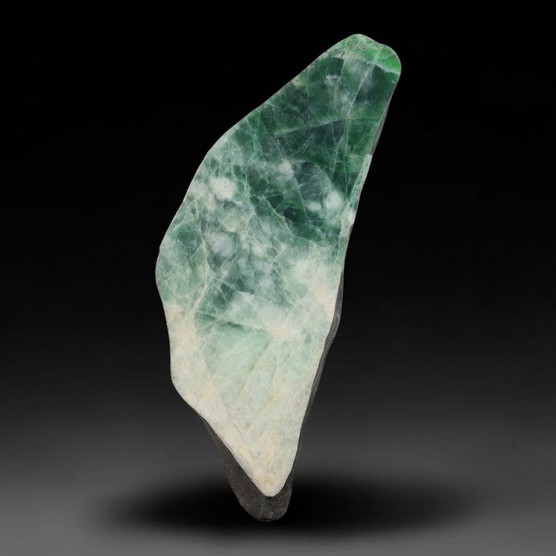 200ct Natural Type A Burmese Jadeite Jade Sliced Rough, 16AZ: This specimen is a sliced rough block of natural Type A Burmese jadeite jade. The interior displays natural colour zoning with visible mineral veining and crystalline patterns typical of unprocessed j