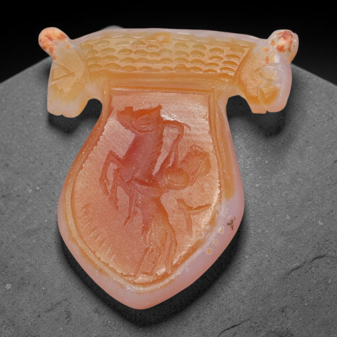 Vintage Natural Carnelian Agate Revival Indo-Persian Glyptic Figural Talisman Amulet Plaque, 67FK: This vintage talisman pendant plaque is skillfully carved from natural banded carnelian agate, crafted in a style referencing ancient Indo-Persian glyptic art traditions. The face bears detailed relie