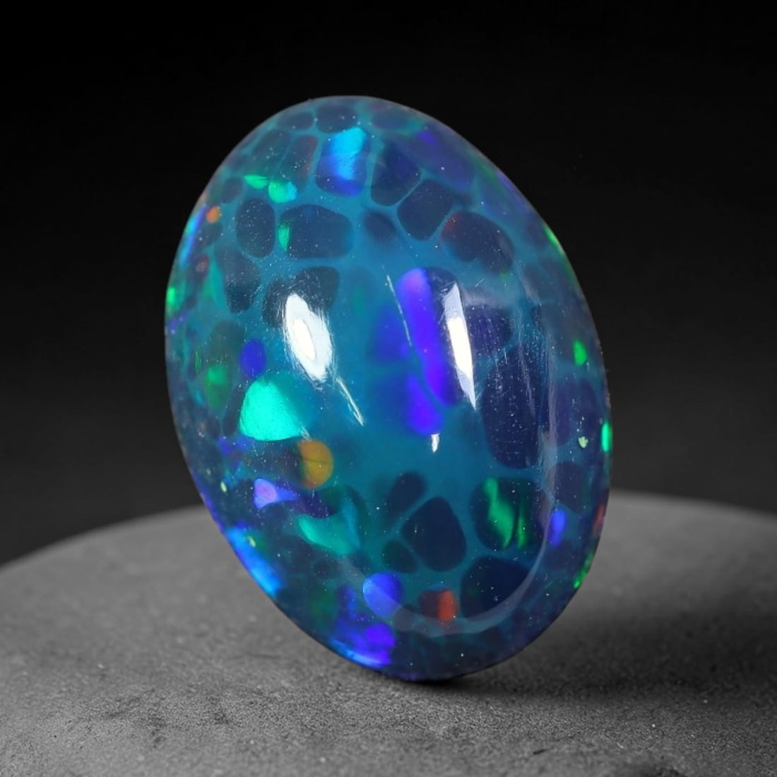 2.24ct Natural Ethiopian Welo Black Smoked Opal Cabochon Loose Gemstone, 28FX: This fully polished Ethiopian Welo opal features a dark smoked base with vivid, sweeping play-of-color shifting across its glossy dome surface, measured at 11x8x5mm. The black smoke treatment deepens 