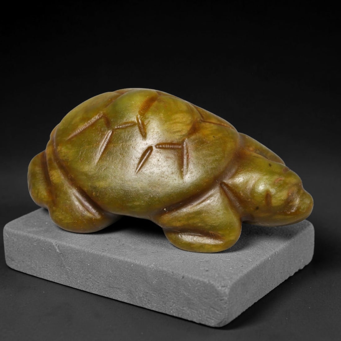 Ancient Medieval Zoomorphic Serpentine Turtle Amulet, 4ED: This talismanic carving is crafted from natural serpentine, sculpted into the form of a turtle with incised detailing defining the segmented shell. Warm aged patina and smooth surface wear accrue from