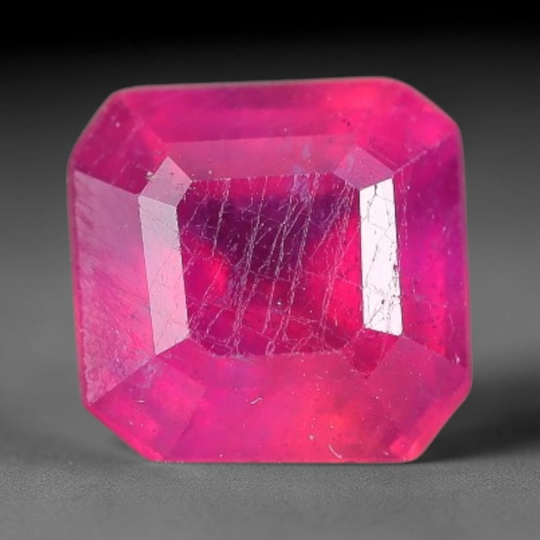 1.45 Carats Natural Madagascar Vivid Fuchsia Red Heated Ruby Loose Gemstone, 29FM: This vivid fuchsia red Madagascar ruby displays rich saturated red tone with subtle natural internal mineral traces that showcase genuine earth-grown character, measured at 6x3.9mm, the intense warm c