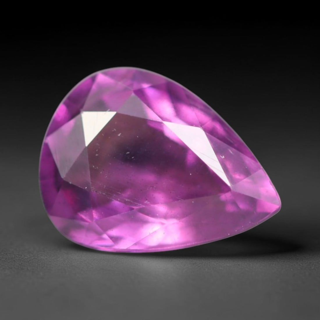 1.39ct Natural Tanzanian Rhodolite Grape Garnet Faceted Loose Gemstone, 99BA: This expertly faceted grape garnet, a scarce saturated purple-magenta rhodolite variant, features transparent crystal structure dotted with faint microscopic mineral specks within its precisely cut re