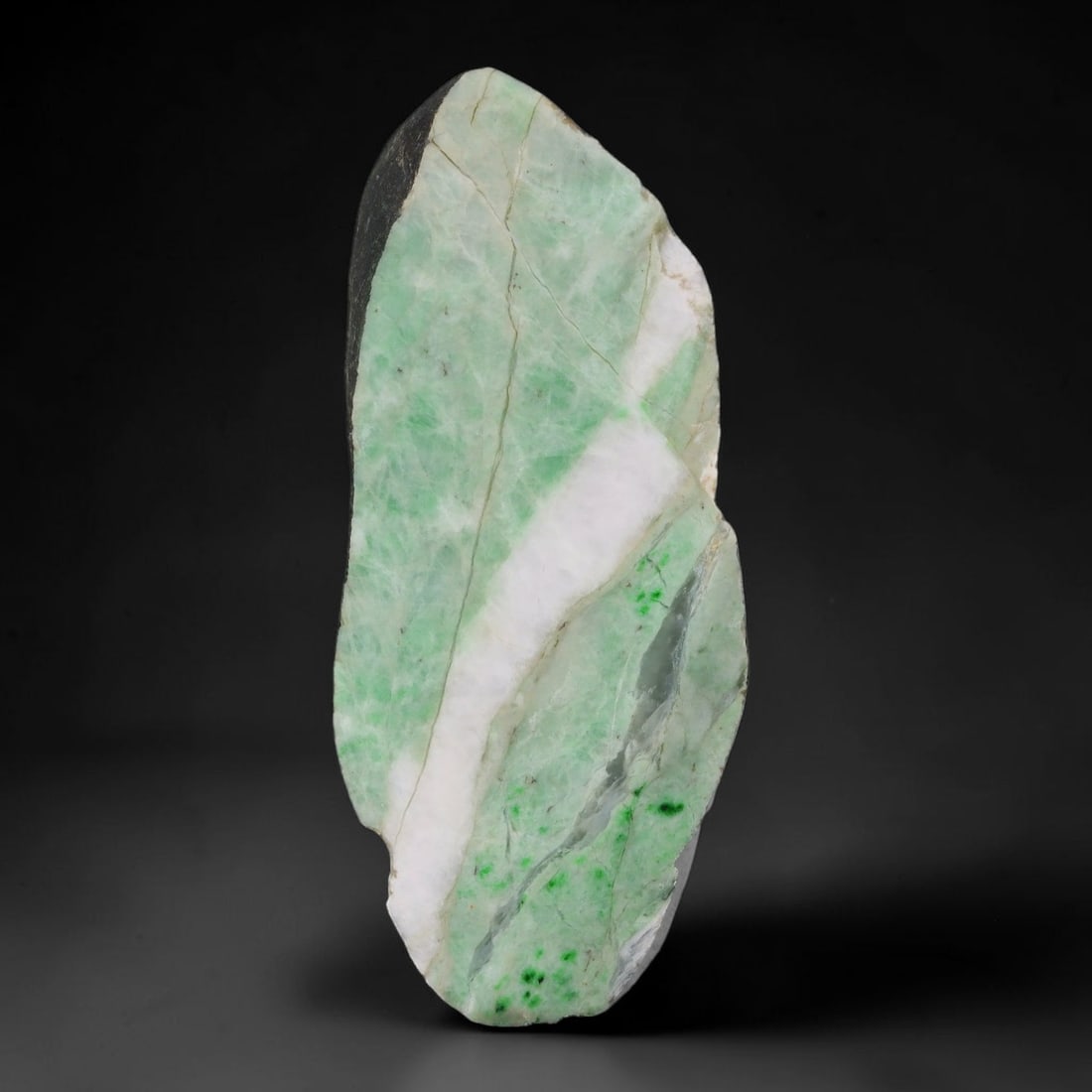 260ct Natural Type A Burmese Jadeite Jade Sliced Rough, 60AZ: This specimen is a sliced rough block of natural Type A Burmese jadeite jade. The interior displays natural colour zoning with visible mineral veining and crystalline patterns typical of unprocessed j