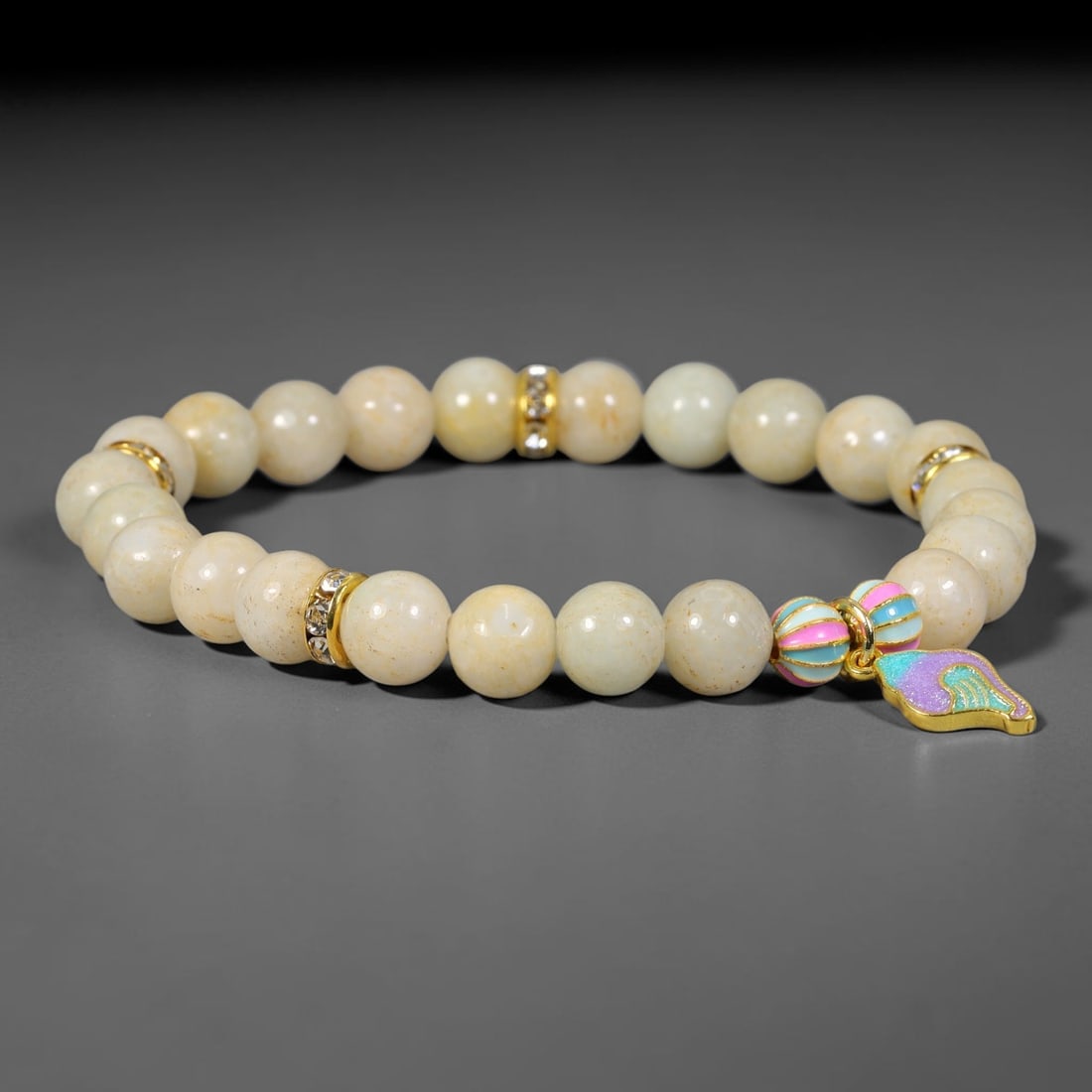 Natural Burmese Type A Jadeite Jade Beaded Bracelet, 17FJ: Crafted from polished natural jadeite jade round beads with soft creamy and pale natural tones. Each bead measures 8mm, arranged into a flexible wearable strand. Clean and elegant, this bracelet is su