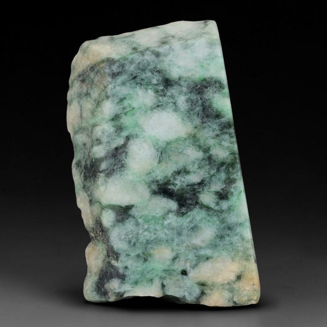 320ct Natural Type A Burmese Jadeite Jade Sliced Rough, 95FA: This specimen is a sliced rough block of natural Type A Burmese jadeite jade. The interior displays natural colour zoning with visible mineral veining and crystalline patterns typical of unprocessed j