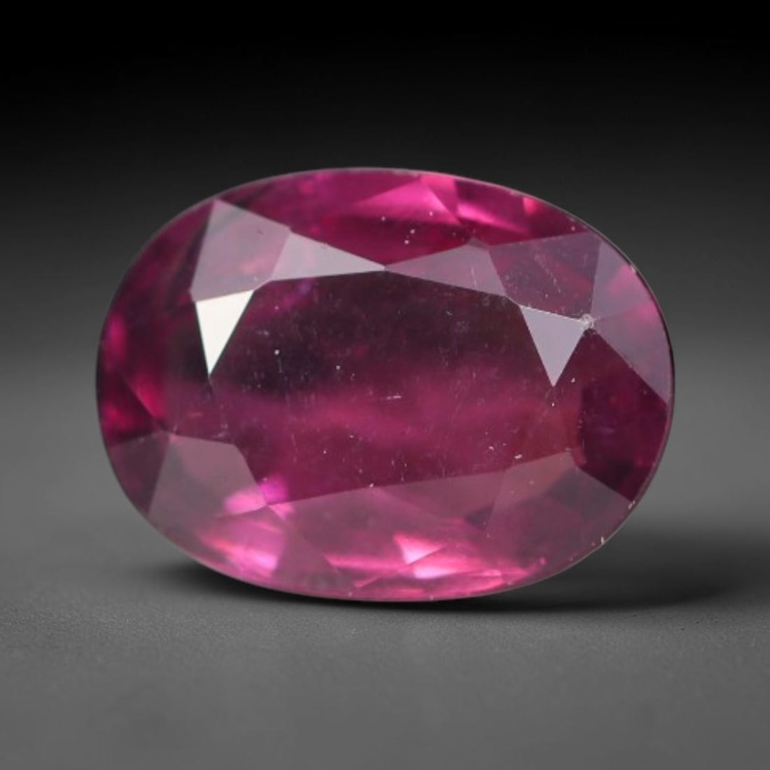 1.34ct Natural Tanzanian Rhodolite Grape Garnet Faceted Loose Gemstone, 91BA: This expertly faceted grape garnet, a scarce saturated purple-magenta rhodolite variant, features transparent crystal structure dotted with faint microscopic mineral specks within its precisely cut re